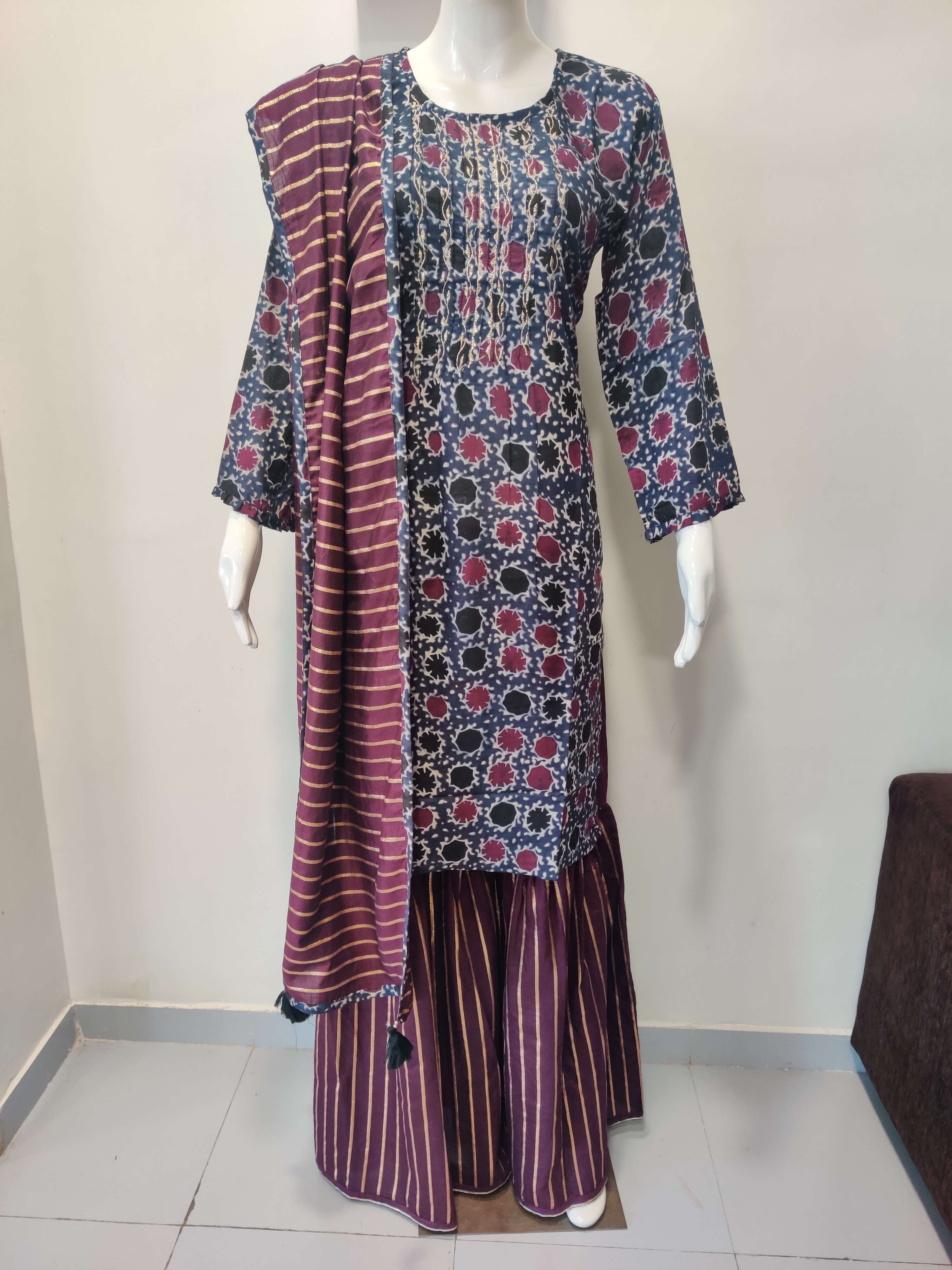 Muslin Print Top with Zari work and Chanderi Sharara with Chanderi Dupatta. 