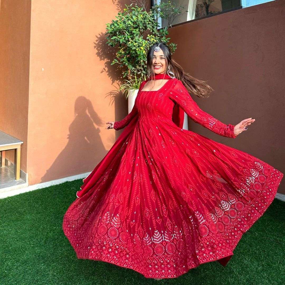 Orange set of chikankari look like a gown 