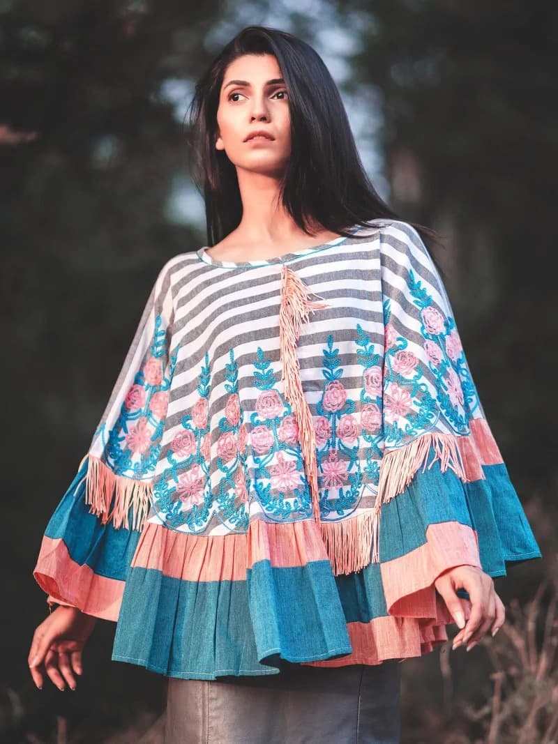 CIRCULAR PONCHO Minute woollen and jute embroidery decorated by Dazzling laces