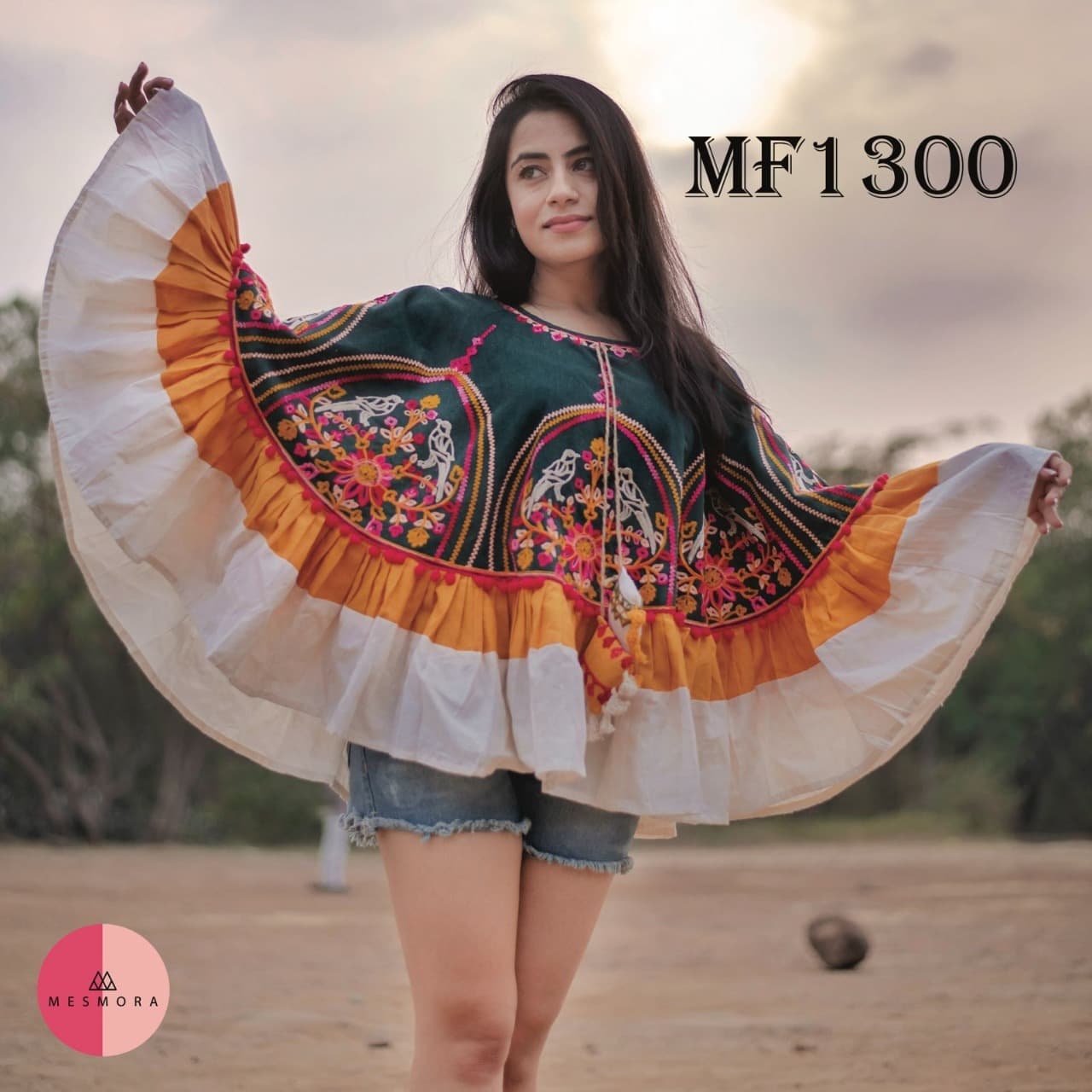CIRCULAR PONCHO Minute woollen and jute embroidery decorated by Dazzling laces