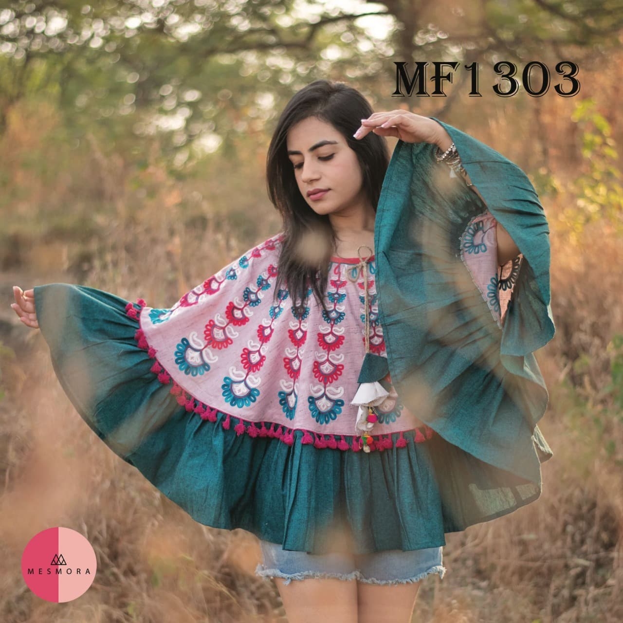 CIRCULAR PONCHO Minute woollen and jute embroidery decorated by Dazzling laces