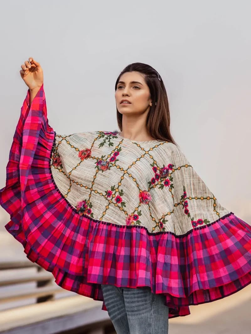 CIRCULAR PONCHO Minute woollen and jute embroidery decorated by Dazzling laces