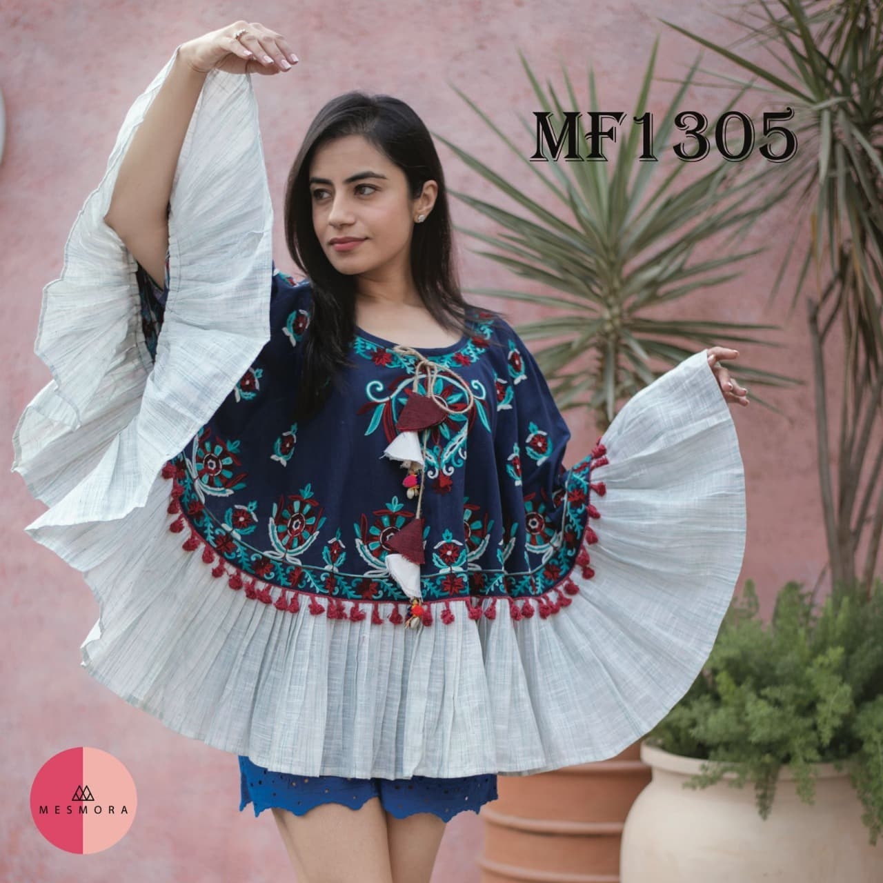 CIRCULAR PONCHO Minute woollen and jute embroidery decorated by Dazzling laces